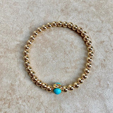 Load image into Gallery viewer, GOLD BEADS WITH TURQUOISE CENTER
