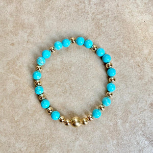 TURQUOISE BEADS GOLD CENTER