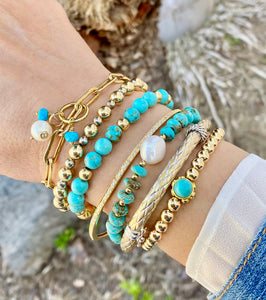 GOLD BEADS WITH TURQUOISE CENTER